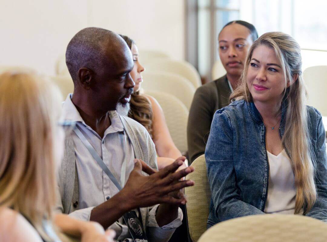 Conference attendees talking to each other